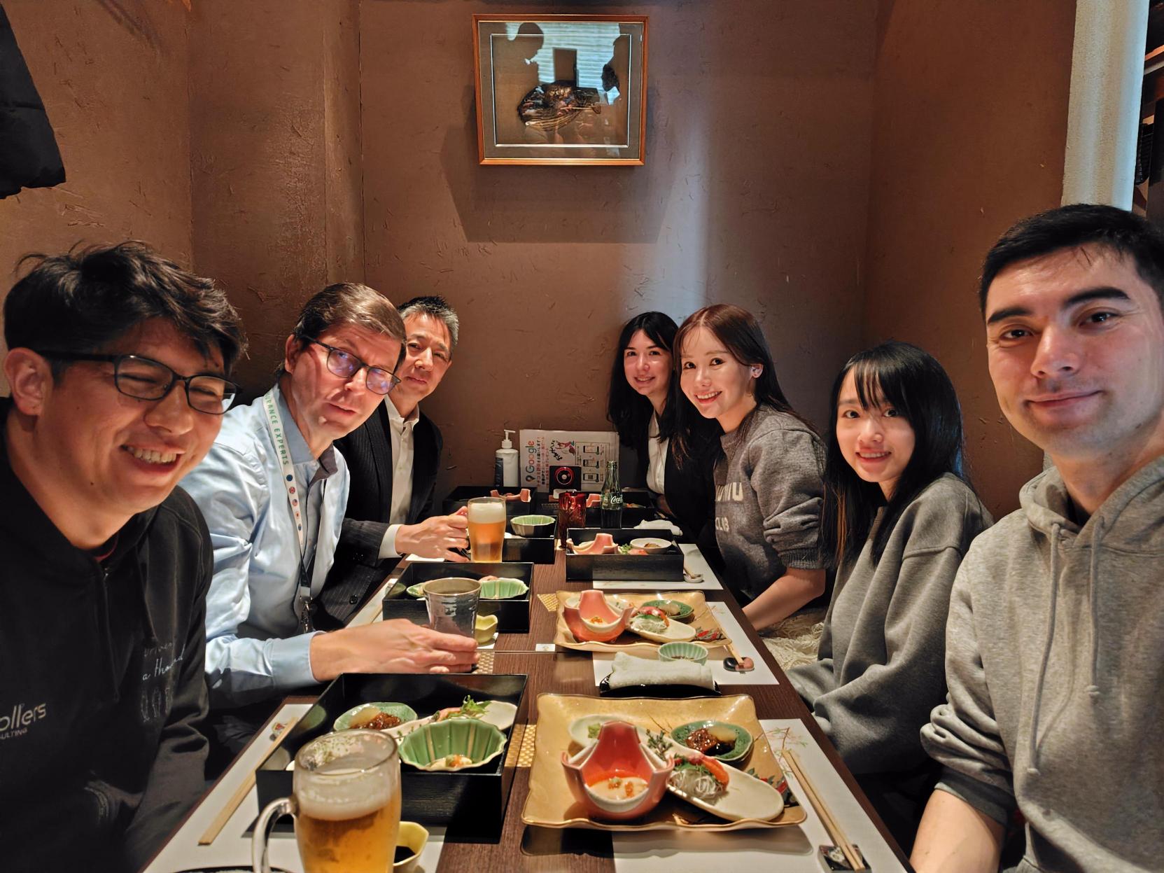 Sollers Consulting Japan employees enjoying a team dinner in Tokyo, reflecting our collaborative and friendly culture.