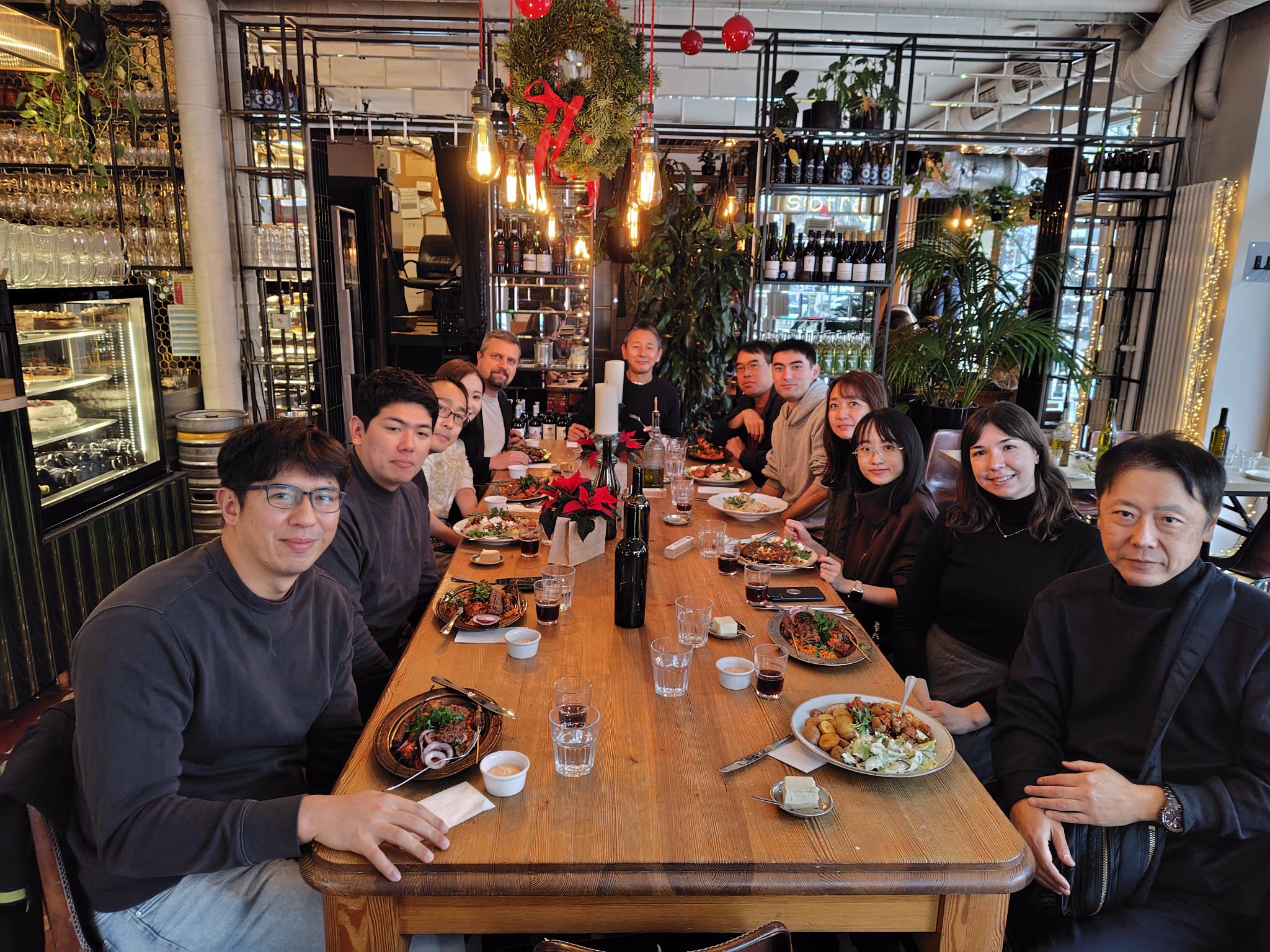 Sollers Consulting Japan employees enjoying a team lunch during the 25th anniversary company trip in Warsaw, Poland.