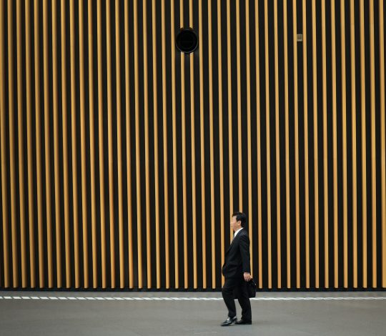 Man in suit Japandi architecture