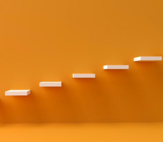 white stairs against orange wall